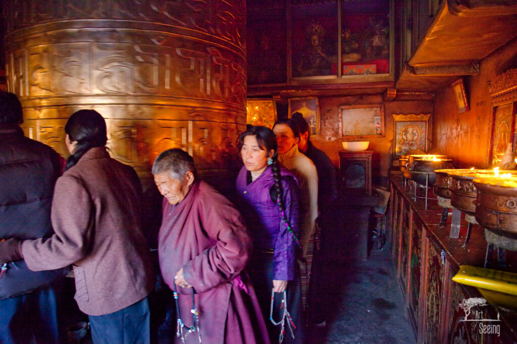 Pilgrims and Prayer Wheel, a travel photograph by Ken Lee