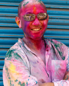 Ken Lee, covered in colour at Holi