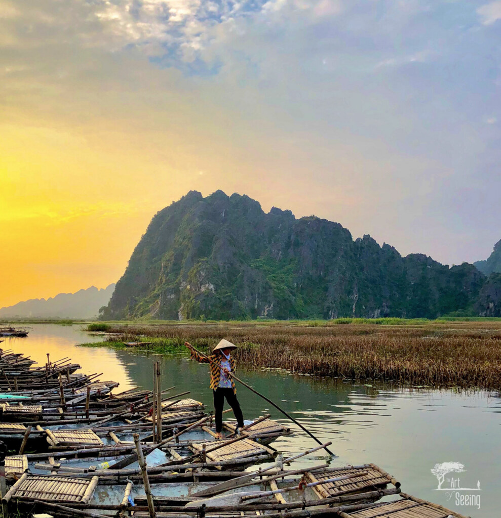 A boatman among the karst peaks, Vietnam